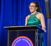 At the Student Veterans of America Ball, Angelina Trillo reads a poem from the "white table," a tradition signifying remembrance of soldiers held prisoner or missing in action.''