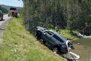 In this photo provided by the National Park Service, a sports utility vehicle is pulled from the inactive Semi-Centennial Geyser in the Wyoming area of Yellowstone National Park on Friday, July 12, 2024. The passengers were able to get out of the acidic, 105 degree Fahrenheit (41 degrees Celsius) water on their own and were taken to the hospital for treatment of non-life-threatening injuries after the crash Thursday morning, park spokesperson Morgan Warthin said in a statement.