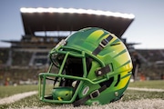 An Oregon Ducks helmet on the field at Autzen Stadium before the football game between the Oregon Ducks and the Oregon State Beavers at Autzen Stadium  November 24, 2023 in Eugene, Oregon. (Photo by Tom Hauck/Getty Images)