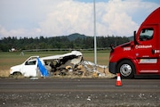 A damaged vehicle sits on the side of the road on Interstate 5, Northbound on Thursday, May 18, 2023, in Marion County. Two semi-trucks and a passenger van were involved in a deadly crash, which occurred near the city of Albany.