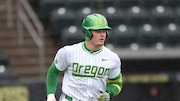 Oregon outfielder Bryce Boettcher (28) runs to first base during an NCAA baseball game against Arizona on Saturday, March 23, 2024, in Eugene, Ore. (AP Photo/Amanda Loman)