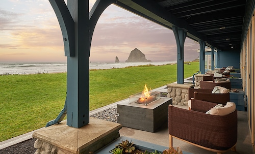 Haystack Rock is seen from sitting areas outside the Stephanie Inn