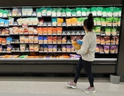 File - A shopper peruses cheese offerings at a Target store on Oct. 4, 2023, in Sheridan, Colo. Inflation is easing slightly, but grocery prices are still high. (AP Photo/David Zalubowski, File)