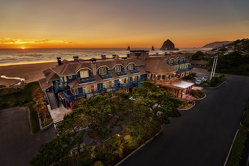 An aerial shot of the hotel with the ocean and Haystack Rock in the background