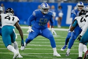 Detroit Lions offensive tackle Penei Sewell plays during the first half of an NFL football game against the Jacksonville Jaguars, Sunday, Dec. 4, 2022, in Detroit. (AP Photo/Duane Burleson)