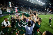 The Portland Timbers lift Dairon Asprilla in celebration after they beat Minnesota United 3-2 on Saturday, June 29, 2024, at Providence Park in Portland. It was Asprilla's last match with the Timbers.