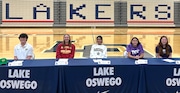 Students from Lake Oswego High School sign their letters of intent to compete in college athletics.