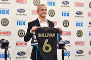 FILE - Philadelphia Union player Cavan Sullivan, 14, holds up his No. 6 jersey during an MLS soccer news conference at Subaru Park in Chester, Pa., May 9, 2024. Sullivan became the youngest player to appear in an MLS match on Wednesday night, July 17. (Jonathan Tannenwald/The Philadelphia Inquirer via AP, File)