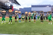 Portland Timbers and Thorns goal-scores hoist slabs following the “Green is Gold” charity match at Providence Park on Wednesday, June 26, 2024.