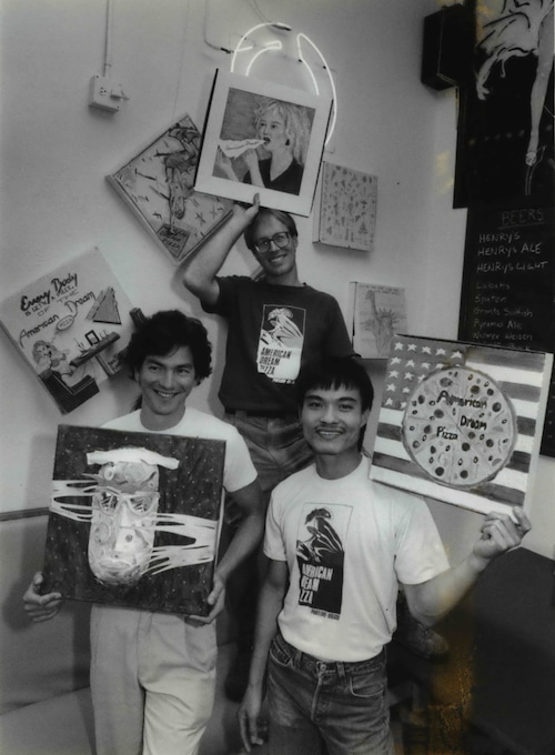 American Dream founders Sebastian Malinow and Scott McFarland and manager Duy Dang display pizza-box artwork at the Northeast Portland restaurant.