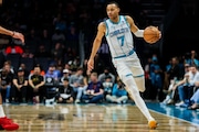 CHARLOTTE, NORTH CAROLINA - APRIL 03: Bryce McGowens #7 of the Charlotte Hornets brings the ball down the court during the first half of a basketball game against the Portland Trail Blazers at Spectrum Center on April 03, 2024 in Charlotte, North Carolina. NOTE TO USER: User expressly acknowledges and agrees that, by downloading and or using this photograph, User is consenting to the terms and conditions of the Getty Images License Agreement. (Photo by David Jensen/Getty Images)