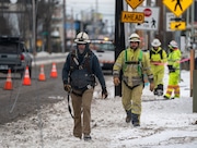 Utility workers, contracted out through Portland General Electric, work to repair power outages near SE 82nd Ave. and Division St. Sunday, Jan. 14, 2024. 