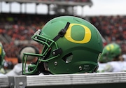 An Oregon helmet sits on an equipment box during the 120th Civil War NCAA football game between the Oregon Ducks and the Oregon State Beavers on November 26, 2016, at Reser Stadium in Corvallis, OR.  (Photo by Brian Murphy/Icon Sportswire via Getty Images)