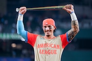 American League's Jarren Duran, of the Boston Red Sox, holds the award for the most valuable player after the MLB All-Star baseball game, Tuesday, July 16, 2024, in Arlington, Texas. (AP Photo/Julio Cortez)