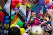 A parade participant on a float at the Portland Pride Parade on June 19, 2022