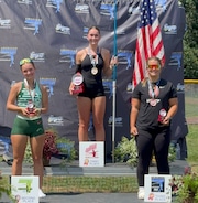 West Linn's Hayden Williams-Downing, middle, stands atop the podium after winning the 2024 American JavFest on Saturday in Pennsylvania.