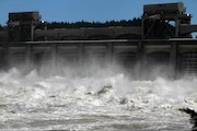 Heavy spring runoff waters boil and churn as they pass through the spillways at Bonneville Dam near Cascade Locks.