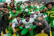 Members of the offensive line pose for a photo after the Oregon Ducks hold their annual spring game at Autzen Stadium in Eugene, Oregon on Saturday, April 27, 2024. 