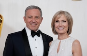 FILE - Bob Iger, left, and Willow Bay arrive at the Oscars on Sunday, March 10, 2024, at the Dolby Theatre in Los Angeles. Angel City FC announced Wednesday, July 17, 2024, that Walt Disney Company CEO Bob Iger and Southern California dean for communication and journalism Willow Bay will be the new controlling owners of what the franchise calls the most valuable women’s sports team in the world.  (AP Photo/Ashley Landis, File)