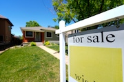 A for sale sign stands outside a single-family residence on the market May 22, 2024, in southeast Denver. On Thursday, June 27, 2024, Freddie Mac reports on the latest average national mortgage rates.