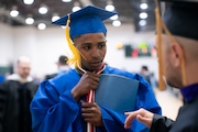 Before Rosemary Anderson High School graduation ceremonies were set to begin, Duke Mitchell talks with his former teacher, Andrew Simon. June 8, 2024