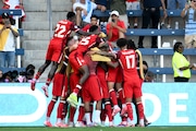 Canada's Jonathan David, not seen, celebrates scoring the opening goal against Peru with teammates during a Copa America Group A soccer match in Kansas City, Kan., Tuesday, June 25, 2024.