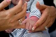 A DHS child welfare caseworker makes a home visit to see a child in foster care in this Oregonian file photo.